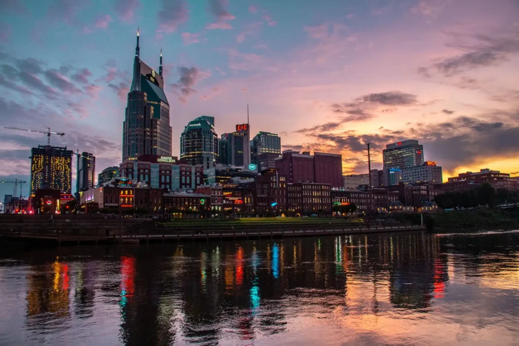 Nashville skyline at sunset reflected on the river